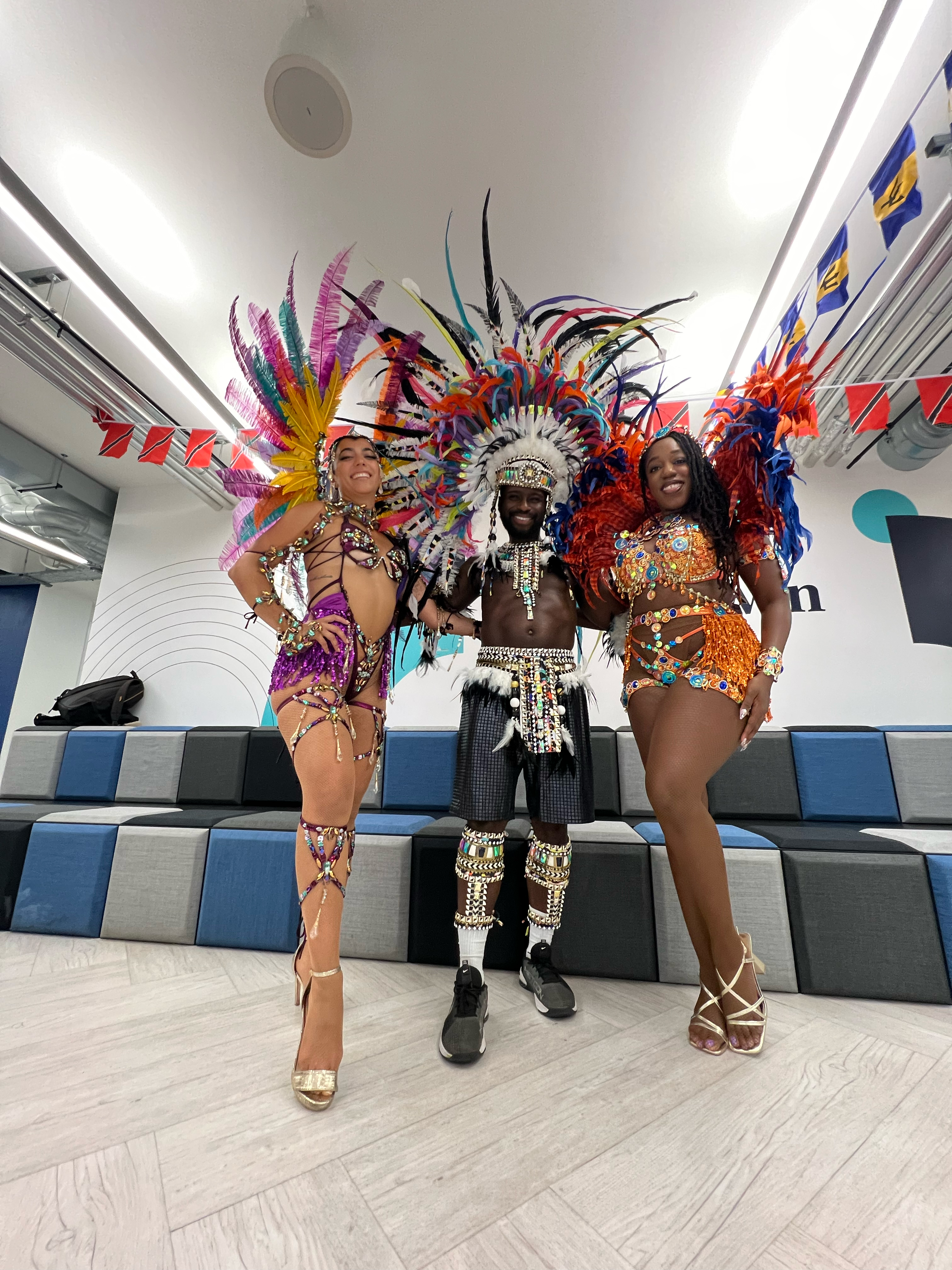 Three dancers in carnival costumes